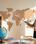 Self Adhesive World Map Wall Chart 39.3 By 18 Inches Lightweight Pinnable Travel Map With 10 Push Pins in a classroom setting