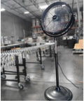 Industrial 20 Inch Drum Fan with Heavy Duty High Velocity Metal Pedestal in warehouse setting