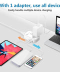 Travel Voltage Converter 220V To 110V With 4 USB Ports And Universal Plug Adapter, powering devices on desk.