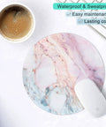Pink Marble Round Mouse Pad With Premium Textured Surface, Washable And Non Slip Rubber Base, shown on desk with keyboard and coffee