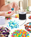 Three Rolls Of 1mm Elastic Beading String Cord, 495 Feet Total, for jewelry making, shown with beads in various colors.