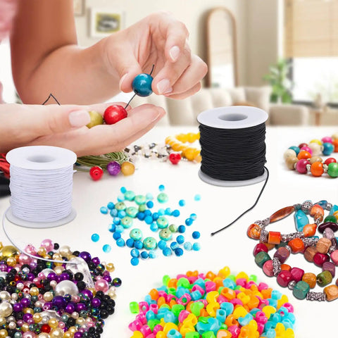 Three Rolls Of 1mm Elastic Beading String Cord, 495 Feet Total, for jewelry making, shown with beads in various colors.