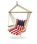 Cozy Hammock Chair With Armrest Support Indoor Outdoor Rope Swing 12 Pattern Options Breathable Fabric Red White And Blue Colorway Ideal For Reading Lounging And Relaxing, featuring a flag pattern and wooden armrests.
