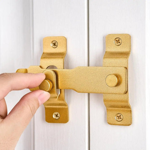Gold Stainless Steel Barn Door Latch For Gate Bi Fold Sliding Door Lock on white surface being installed by hand, 4.33 x 3.23 inches.