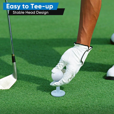 Golfer placing ball on adjustable golf tees for driving range and simulator beefy unbreakable rubber tees built for durability