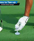 Person placing a golf ball on Adjustable Rubber Golf Tees For Mats And Driving Range Your Swing Height Solved Unbreakable Tees