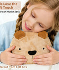 Child holding Little Bear DIY Sewing Kit For Beginners Kids Arts And Crafts Plush Crossbody Bag With Zipper, smiling and hugging plush bear bag.