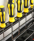 Close-up of Power Tool Organizer Wall Mount For Garage With Drill Holder And Storage Rack storing yellow screwdrivers.