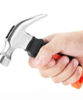 Hand holding 8 Oz Stubby Claw Hammer Mini 6 Inch with soft rubber grip for home repair and DIY tasks, compact and ergonomic.