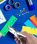 Two Piece Metal Hole Punch Set With One Quarter Inch And One Eighth Inch Single Hole Punches for crafting colorful paper.