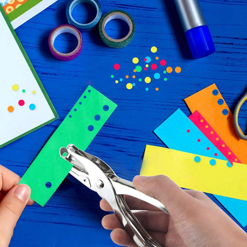 Two Piece Metal Hole Punch Set With One Quarter Inch And One Eighth Inch Single Hole Punches for crafting colorful paper.
