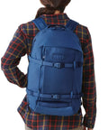 Person wearing Crossroads 27L Everyday Backpack Built With Durable TuffSkin Nylon And 700D Material For Commuters And Weekend Warriors