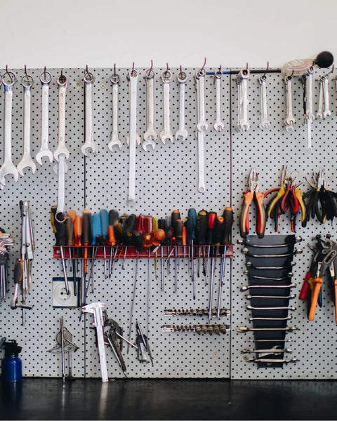 Compact Twenty Piece Wrench Set With Metric And SAE Sizes on pegboard, includes open end and combination wrenches, storage ready.