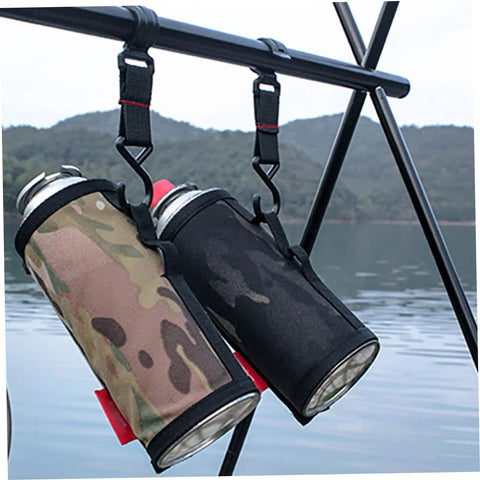 Two water bottles secured on a pole with S Shaped Movable Strap Hooks from Five Piece Large Outdoor Camping Hook Set by a lake