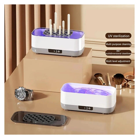 Portable Ultrasonic Cleaner With Rechargeable Battery For Jewelry And Watches One Touch Control on a table with a watch and tools.