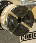 Close-up of the HTC125 5 Inch Four Jaw Woodturning Chuck Kit with dovetail jaws on a wood lathe.