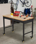 Tough As Nails Mobile Workbench 60 Inch Adjustable Shop Table With Solid Rubberwood Top in garage setup with tools.