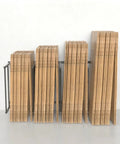 Industrial Grade Cardboard Box Organizer And Vertical Carton Storage Rack For Art Canvases Office Supplies Warehouse Packaging With Dead Simple Tool Free Setup displaying stacked cardboard boxes on a metal frame.