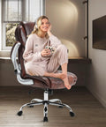 Woman seated on Big And Tall Leather Office Chair With Flip Up Arms High Back Executive Desk Chair On Wheels Brown
