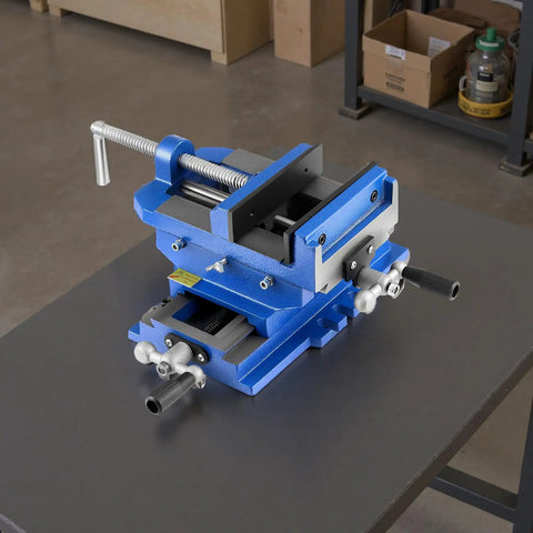 Cross Slide Drill Press Vise With 6 Inch Jaw 2 Way X Y Axis Heavy Duty Cast Iron Bench Vise Clamp on a workbench