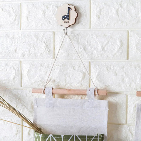 Over door hanging shoe organizer bag crafted from soft cotton linen with wooden frame, perfect for bedroom, bathroom, and garage.