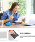 Person smiling at desk with laptop and letter, image of White Poly Mailer Envelopes 16x22 Inches Self Sealing Shipping Bags shown below