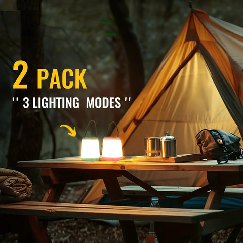 Two Pack LED Camping Lights Lanterns Battery Powered With Three Modes Portable Night Light on picnic table near tent