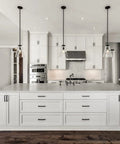Slick Matte Black Cabinet Pulls Square 5 Inch Center To Center Drawer Handles 25 Pack installed on white kitchen cabinets.