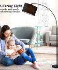 Arc Floor Lamp For Living Room With Fully Dimmable Stepless Brightness, No Fuss Adjustable Head, Tall Modern Black Standing Lamp Over Couch For Reading, Bedroom, Office, Bulb Included next to a mother and daughter sitting on the floor.