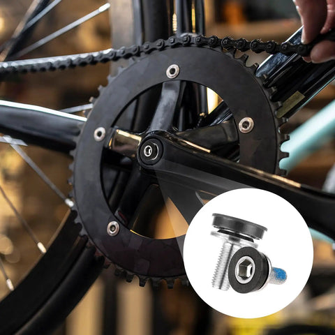 Close-up of a bike crankset with six 8mm hex crank arm bolts with caps for square cranksets, durable metal construction.