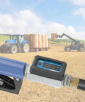 Aluminum Body Turbine Fuel Flow Meter with battery powered digital display in farmland with tractors in background