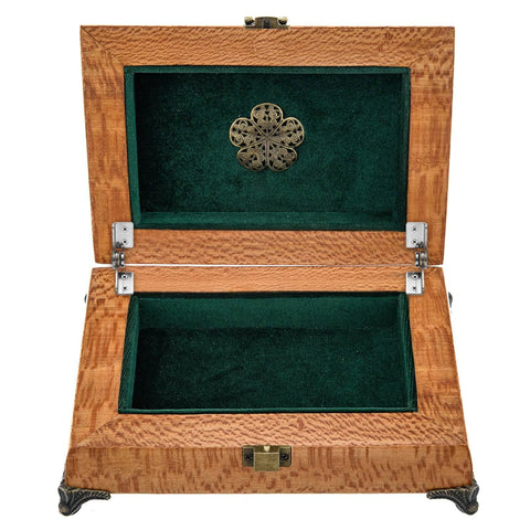 Open wooden jewelry box with green velvet lining and decorative metal clasp