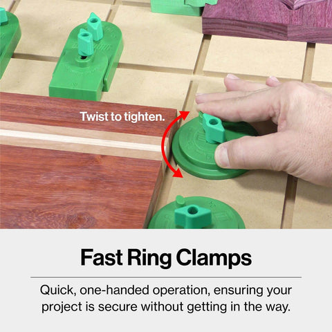 Hand adjusting Matchfit Workholding Clamp Kit And Dovetail Router Bit Bundle with One Quarter Inch Shank on wooden surface