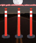 Real McCoy Heavy Duty Traffic Delineator Posts With Weighted Rubber Bases And Bright Reflective Strips For Parking Lot Safety Markers Road Construction Warning Stakes 42 Inch Tall Six Pack Built Tough positioned at night.