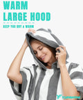 Woman wearing striped Hooded Surf Poncho Towel For On The Go Privacy Women Men Changing Robe with large hood