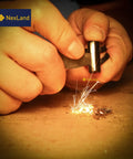 Hands using Ceramic Striker Fire Starter Necklace With Ferro Rod Toggle And Paracord All In One Bushcraft Emergency Fire Starter Kit