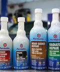 Head Gasket Stop Leak Sealant 16 Fl Oz bottle with other automotive repair products in a workshop