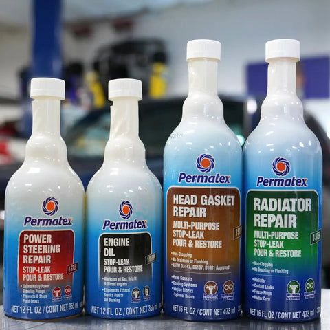 Head Gasket Stop Leak Sealant 16 Fl Oz bottle with other automotive repair products in a workshop