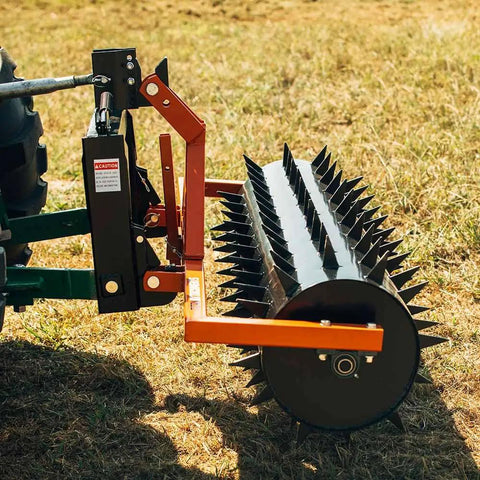 Close-up of Six Foot Drum Spike Aerator for 3 Point Hitch on Cat 1 and Cat 2 Tractors, showing spikes and attachment mechanism