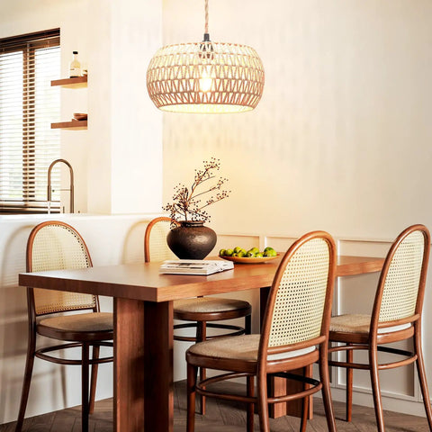Real Deal Plug In Pendant Light Featuring Woven Rattan Shade And Hassle Free On Off Switch illuminating a dining table.