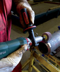 Heavy Duty Variable Speed Die Grinder With Badass High Torque Planetary Gears And Easy Swap Spindle Lock For Rock Solid Metalworking and finishing jobs featuring smooth nine hundred fifty watt motor in use on metal surface.