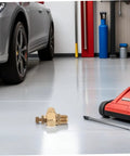 Brass Pneumatic Speed Controller With Quarter Inch NPT Male Thread And Eight Millimeter Push In Tube Fitting For Precise Air Flow Regulation In Automotive Door Systems And Built To Last Heavy Duty Industrial Rigs on garage floor