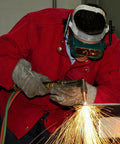 Person using Built Like A Tank Oxy Acetylene Welding Hose 50 Foot 1/4 Inch Twin Line Rubber Cord in a workshop for cutting metal.