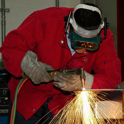 Person using Built Like A Tank Oxy Acetylene Welding Hose 50 Foot 1/4 Inch Twin Line Rubber Cord in a workshop for cutting metal.