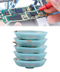 Pile of four spools of Desoldering Solder Wick Braid Copper Alloy 3mm By 1.5m for PCB repair, shown with a circuit board in use.