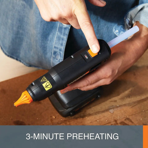20V Cordless Full Size Hot Glue Gun with 382°F High Heat, 3-Minute Preheat, being operated on a wooden surface