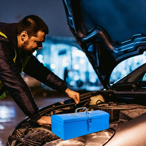 Heavy Duty Blue Metal Toolbox For Mechanics Portable Storage Case on a car hood during nighttime repairs.