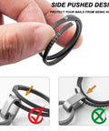Close-up of Black Titanium Key Ring With Innovative Side Push Pump Design being held, showing heavy-duty keychain accessory for fast swaps.