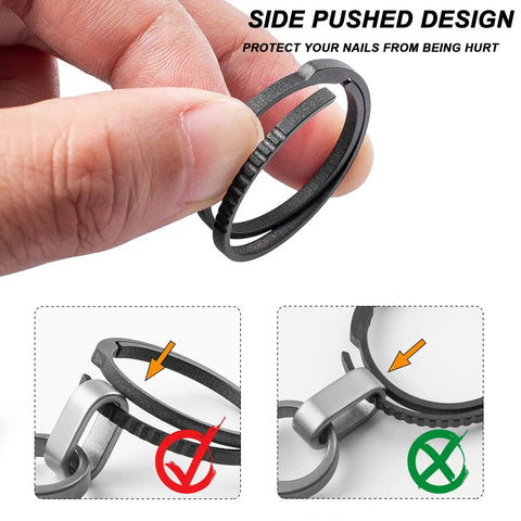 Close-up of Black Titanium Key Ring With Innovative Side Push Pump Design being held, showing heavy-duty keychain accessory for fast swaps.