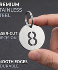 Close-up of a stainless steel key tag with number 8, part of the 50 Pack Round Metal Key Tags 1 To 50 Stainless Steel ID Tags With Hole For Key Boxes.